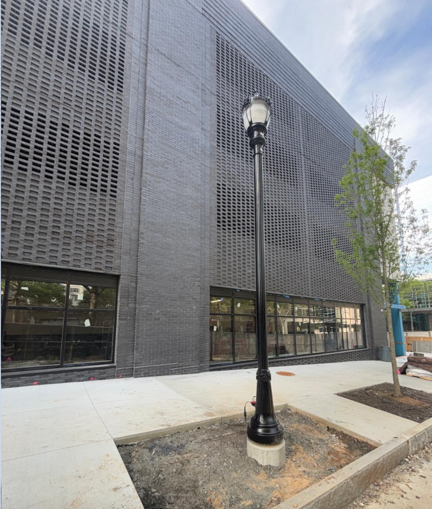 Trees and light pole installation on sidewalks next to Rambler Atlanta. 